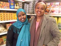 Saido Farah (L) and Deeqo Jibril (R) inside Farah's business, Roots Halal Meat Market. / Credit:Talia Whyte/IPS